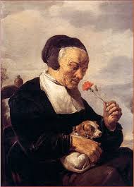 David Teniers (1610-1690): “Anciana oliendo un clavel”. Una escena amable de la vida cotidiana es retomada por el artista, quien inmortaliza los actos menudos con gran riqueza de color, emoción y poesía, poniendo el frescor de una técnica de sorprendente virtuosismo.