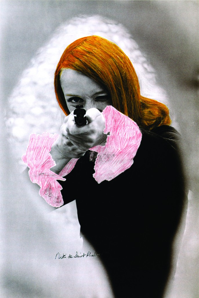 Niki de Saint Phalle aiming; colored Film-Still of "Daddy", 1972
